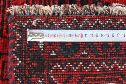 Close-up of a Qashqai rug runner: sewn-in label with numbers along the edge