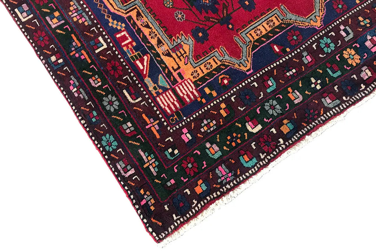 Sirjan carpet: corner view with a multi-row border pattern and colorful small motifs