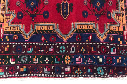 Sirjan carpet: close-up of a border with ornamental stripes and colorful accents