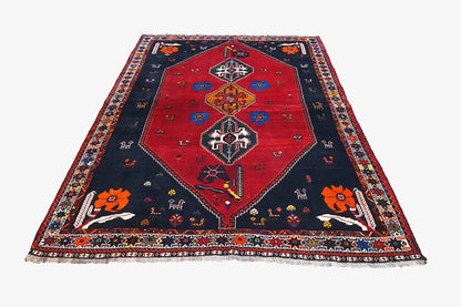 Oriental rug, flat-woven: red center on a dark blue background with a decorative border
