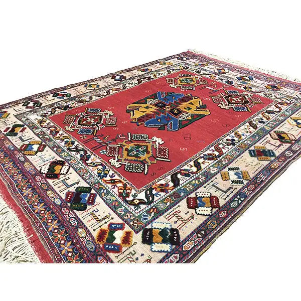 Soumak rug (200x145 cm) with a red patterned field and multicolored decorative border