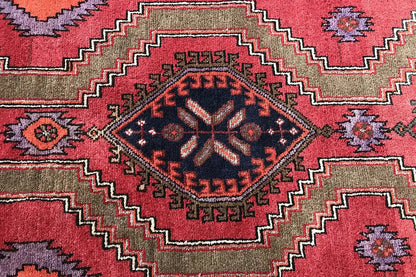 Detail of the Hamadan runner: central ornament with red zigzag lines and fine borders