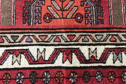 Hamadan runner detail at the edge: alternating ornamental border and patterned bands