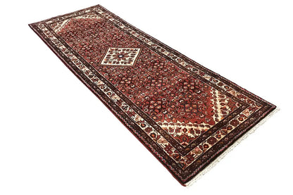 Hamadan runner with a burgundy pattern and a wide border frame
