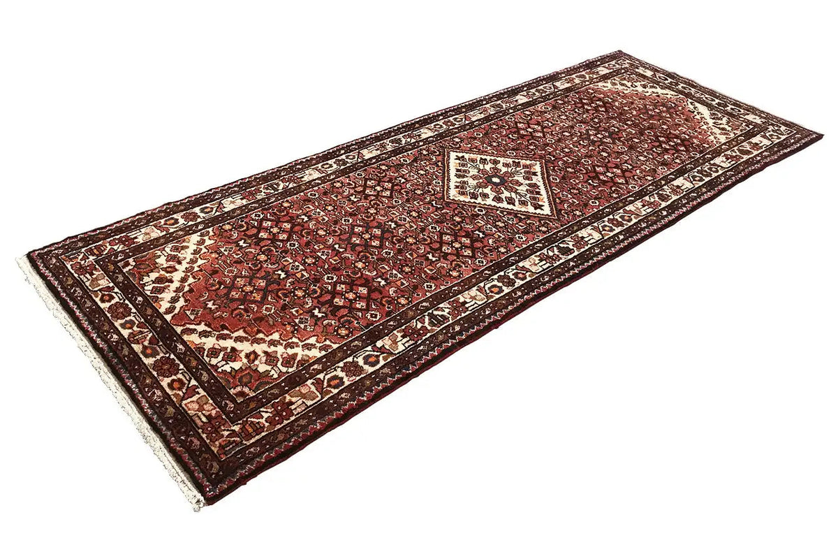 Hamadan rug with a reddish-brown ornamental field and central medallion design