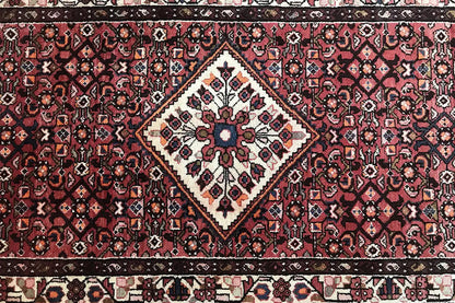Hamadan runner detail: central diamond with decorative flowers and intricate ornamentation