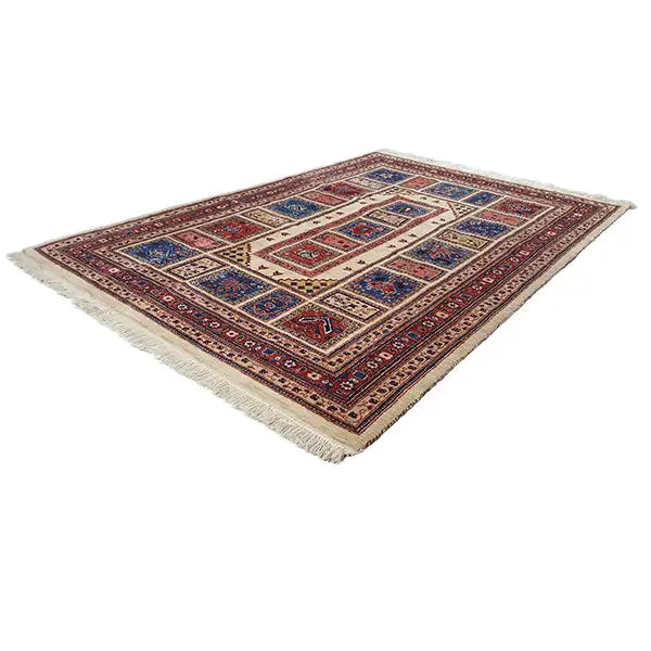 Classic landscape-oriented Oriental rug with a geometric pattern, red and blue on a light background