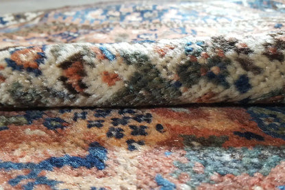 Carpet pile in detail, blue-brown patterns with colorful accents