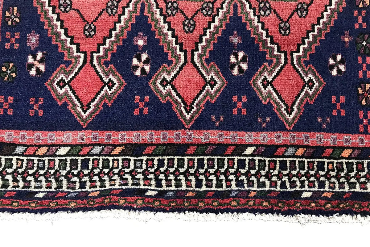 Sirjan runner edge: dark blue rug with triangular and zigzag motifs as well as fringes