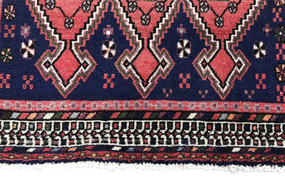 Sirjan runner edge: dark blue rug with triangular and zigzag motifs as well as fringes