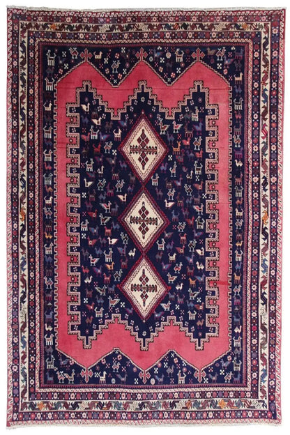 Oriental rug with a dark blue background, red medallion, and ornamental borders
