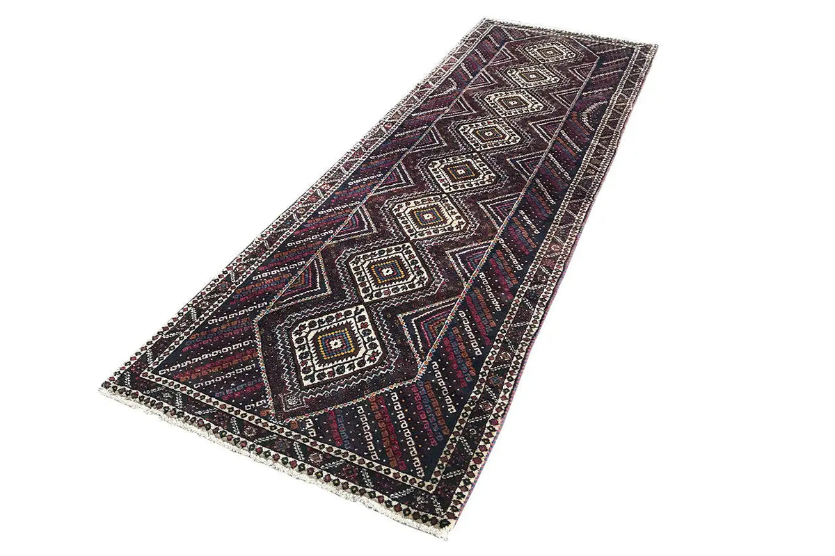 Dark runner with zigzag and diamond design, multicolored accents