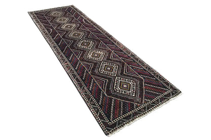 Runner with multicolored diamonds and lines, border trim, dark background