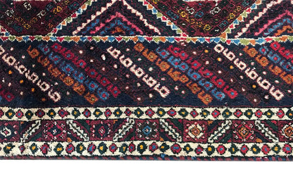 Close-up: runner pattern with stripes, diamonds, and ornaments in red, blue, and white