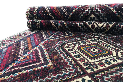 Sirjan runner with a geometric, multicolored pattern in dark blue, cream, and burgundy