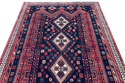 Rug with a central diamond and decorative zigzag lines in dark blue and red
