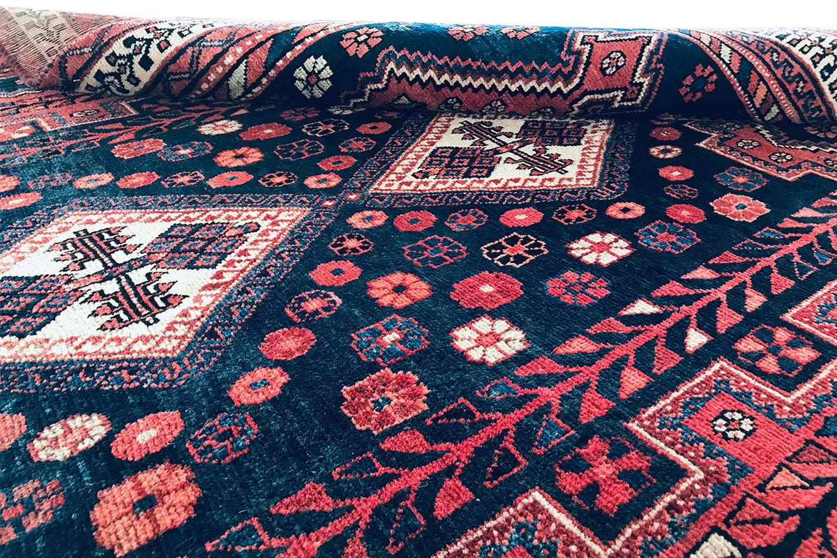 Rug surface with medallions and ornaments in dark blue, red and white