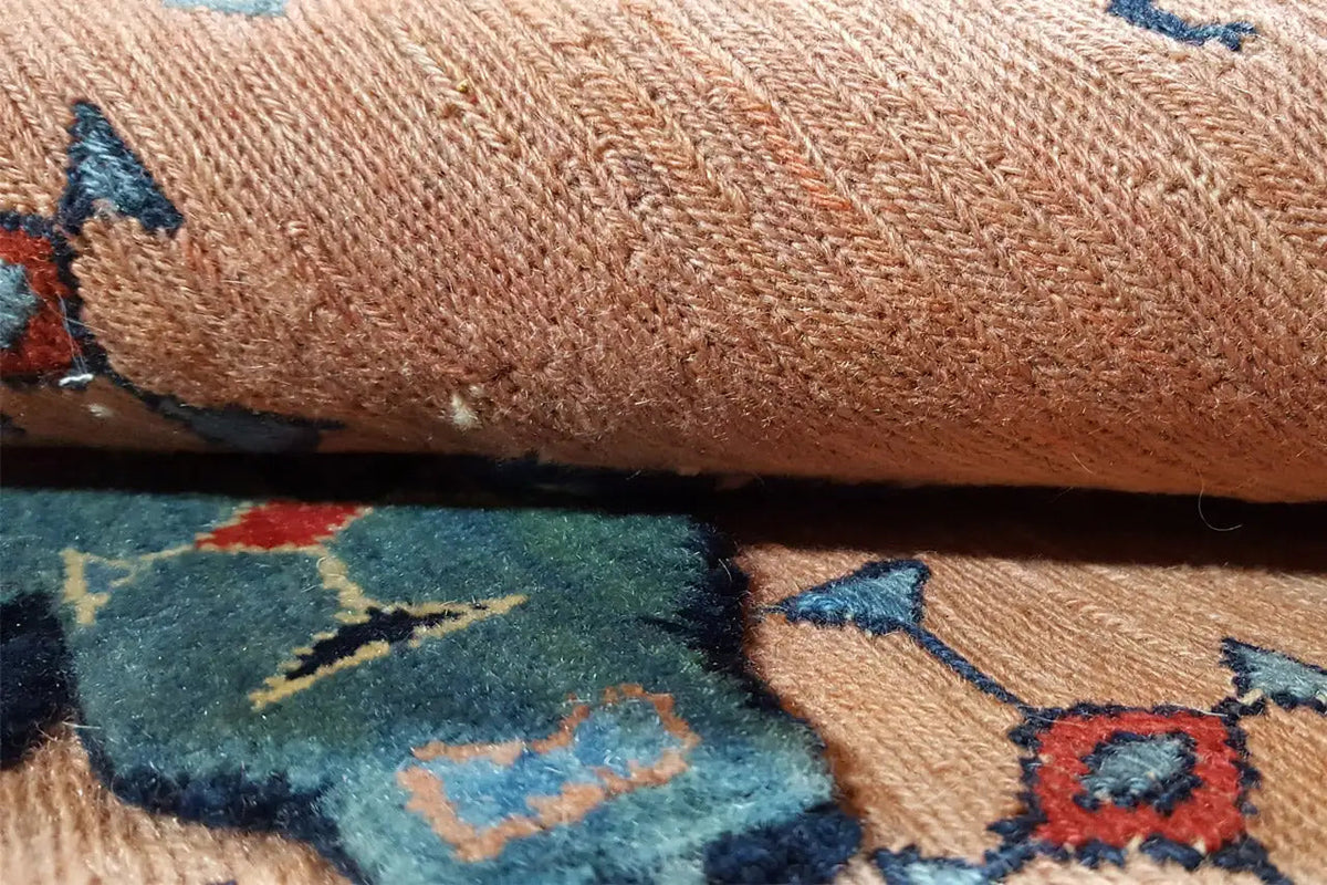 Close-up: carpet pile with a woven pattern in beige, blue, and red