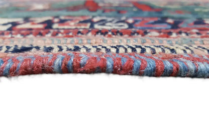 Carpet edge with multicolored fringes in blue, red, and beige