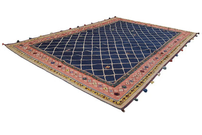 Soumak rug with a dark blue lattice field and red-gold borders, tassels