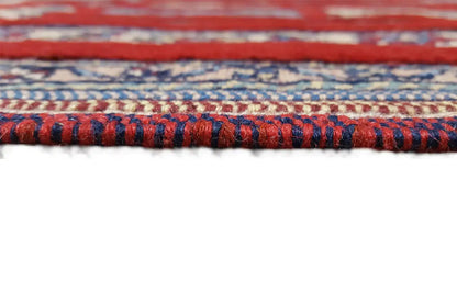 Rug edge with fringe and a blue-and-red patterned border, fine embroidery
