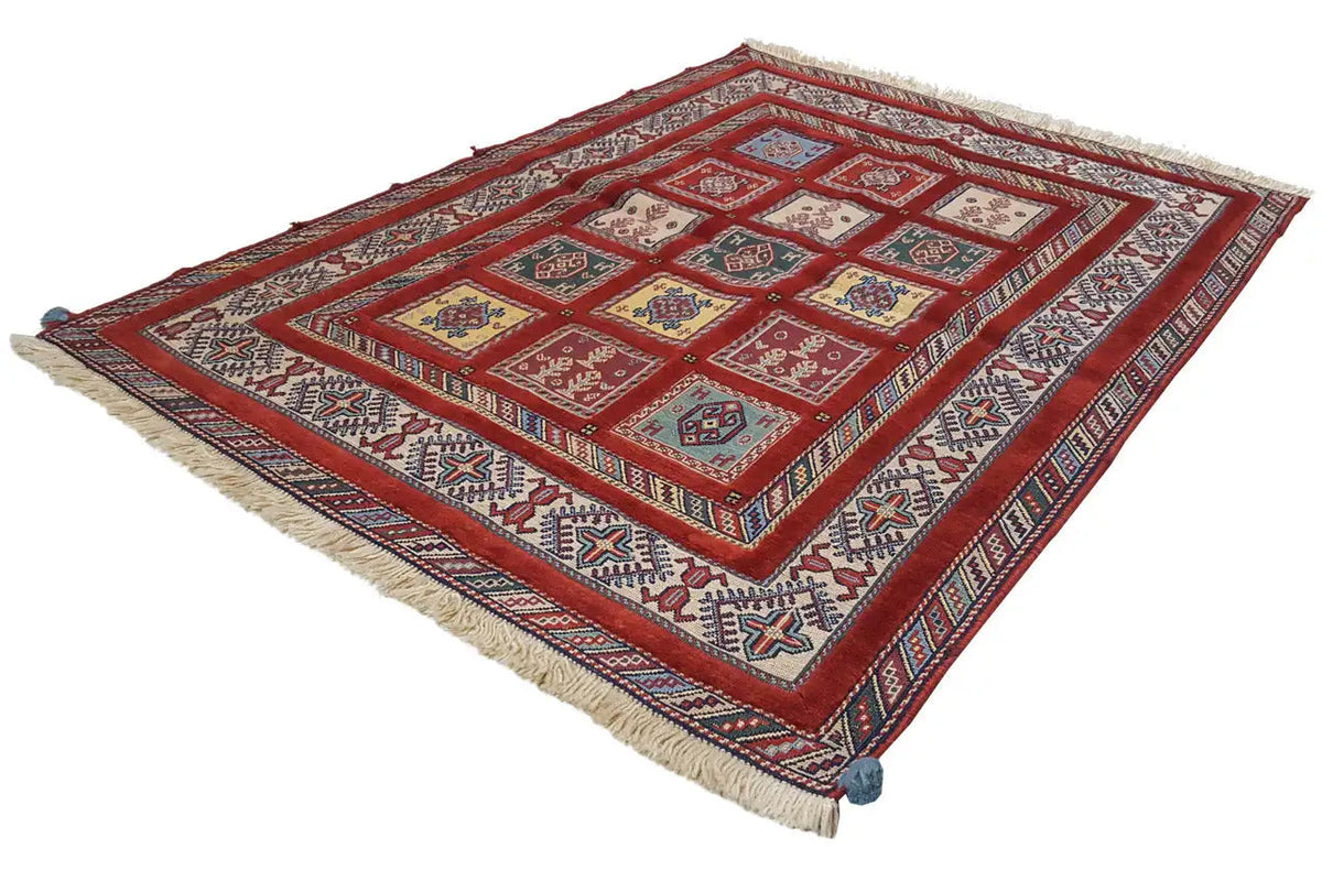 Oriental rug with a red pattern and multicolored borders, edges with fringes