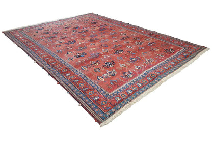 Rectangular rug with a reddish-brown ground and blue border, fine ornamental pattern