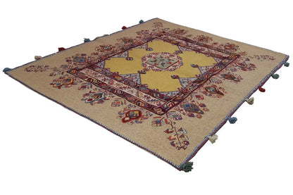 Soumak rug 120x100 cm with a beige background, medallion pattern, and tassels at the corners