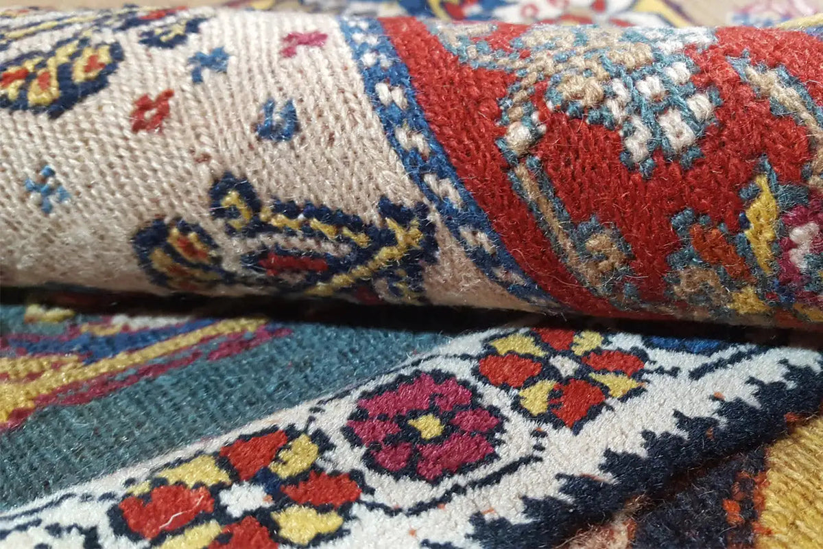 Soumak rug: Textural detail with pile and pattern motifs in blue, red, and cream