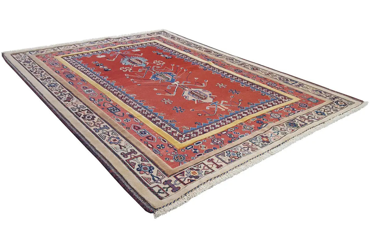 Carpet with a red center and blue ornamental field, multicolored border