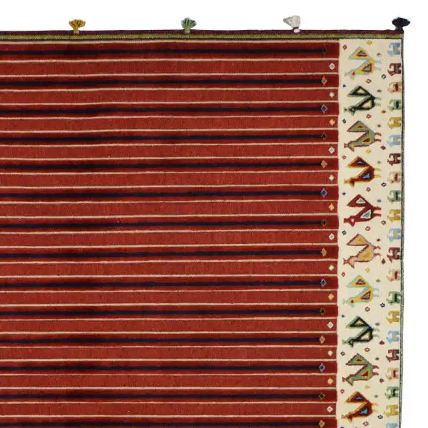 Soumak rug with reddish-brown stripes and a narrow border, topped with colorful balls
