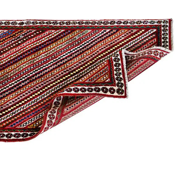 Gabbeh rug corner with hemmed borders and a tiered stripe pattern, multicolored