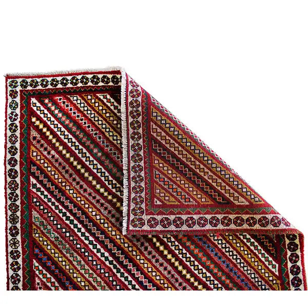 Gabbeh rug in a triangular section: bordered frame and diagonal stripes, multicolored