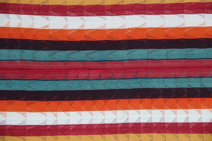 Close-up of a Jajim rug with red, green, and orange horizontal stripes