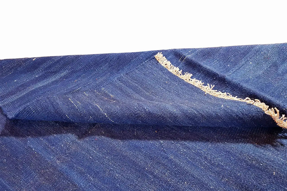 Blue kilim rug, selvedge with beige edging and fine grain pattern