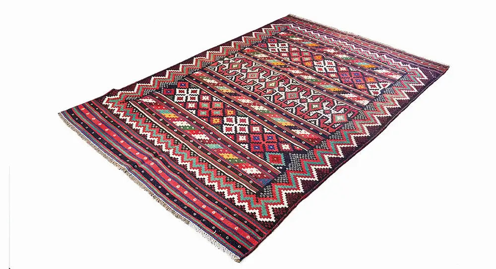 Kilim rug with multicolored zigzag and ornamental patterns; rectangular, with fringes.