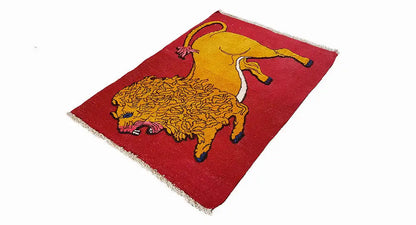 Carpet with a lion motif, yellow on a red background, with fringes