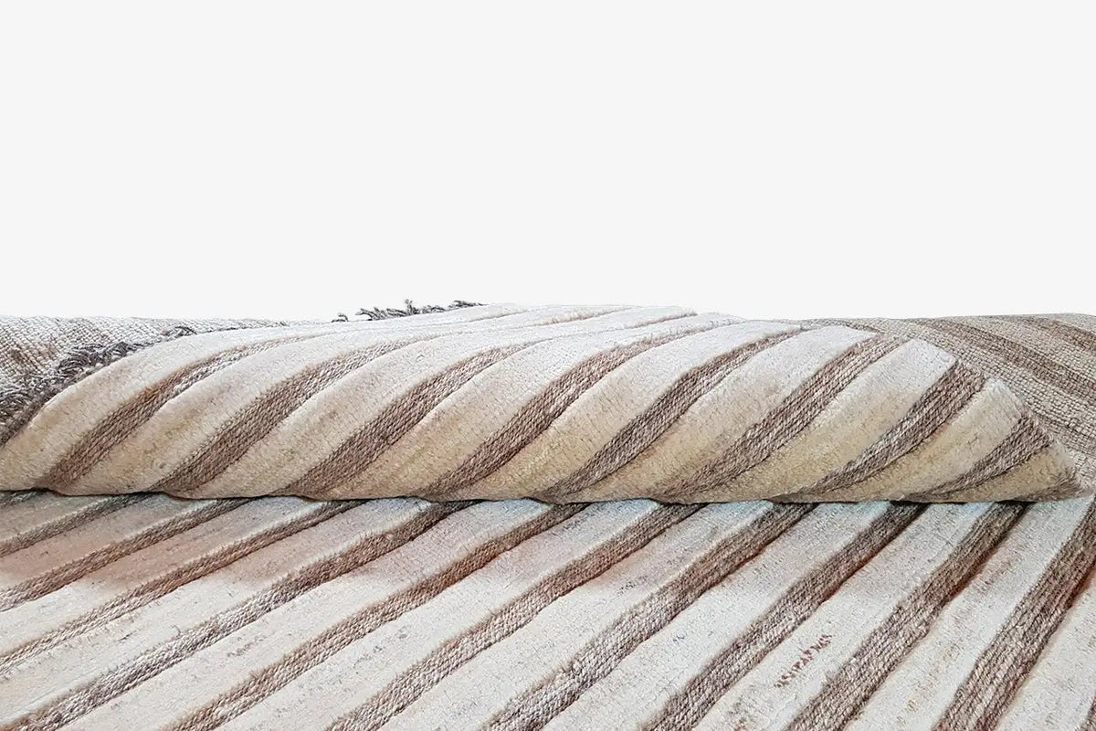 Kelim Gabbeh rug in detail: overlapping edge view and striped weave structure