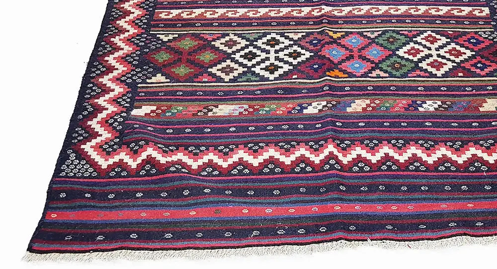Kilim rug with multicolored ornaments, stripes and fringes, dark blue and red