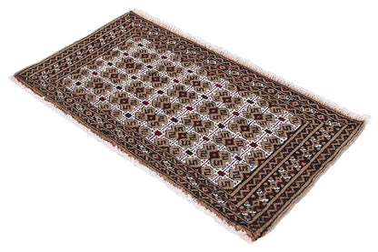 Turkmen carpet, spread diagonally, geometric patterns in dark brown and white