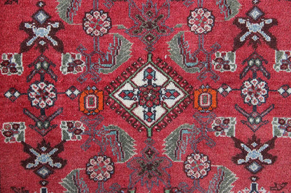 Close-up: red carpet pattern with medallion, ornaments, and borders