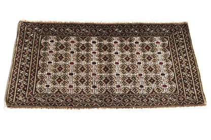 Turkmen carpet 100x52 cm with a geometric pattern in dark brown, beige, and red