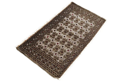 Turkmen carpet 100x52 cm with a framed border and fine pattern in dark brown and beige