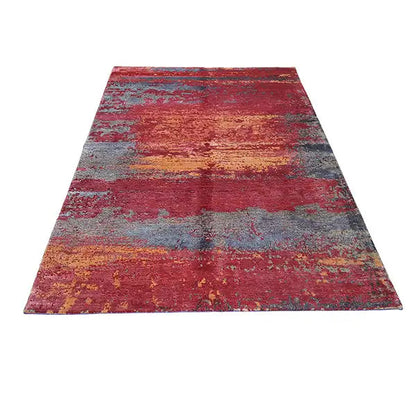 Rug with an all-over layout, red-gray-blue color fields, and a fine relief texture