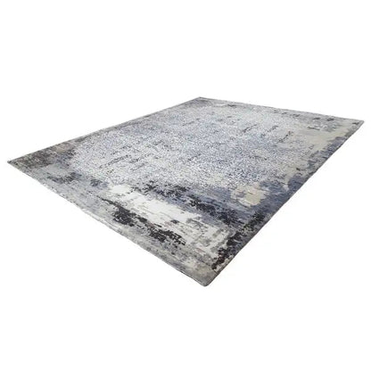 Flat rug with blue-gray, abstract vintage patterns and light accents