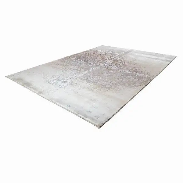 Rectangular rug with a light beige base and gray ornamental and textured pattern