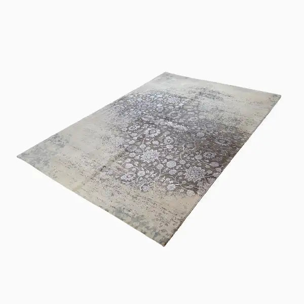 Rectangular rug with a beige background and brown-gray paisley ornaments