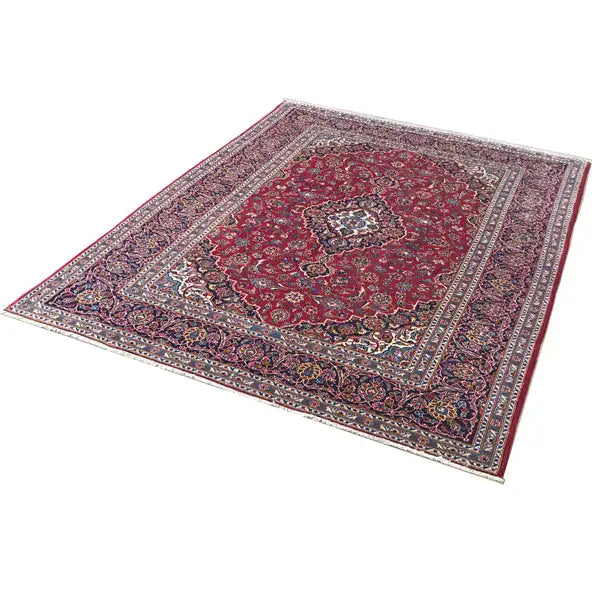 Keshan rug, red design with an ornamental medallion and a wide border pattern