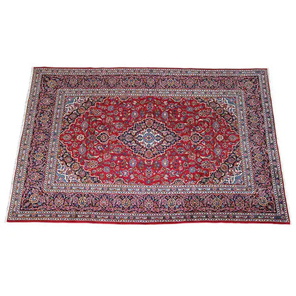 Carpet area with a red ground, blue corner ornament, and fine, multicolored border