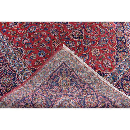 Rug section: red field with a blue linear border and decorative floral patterns